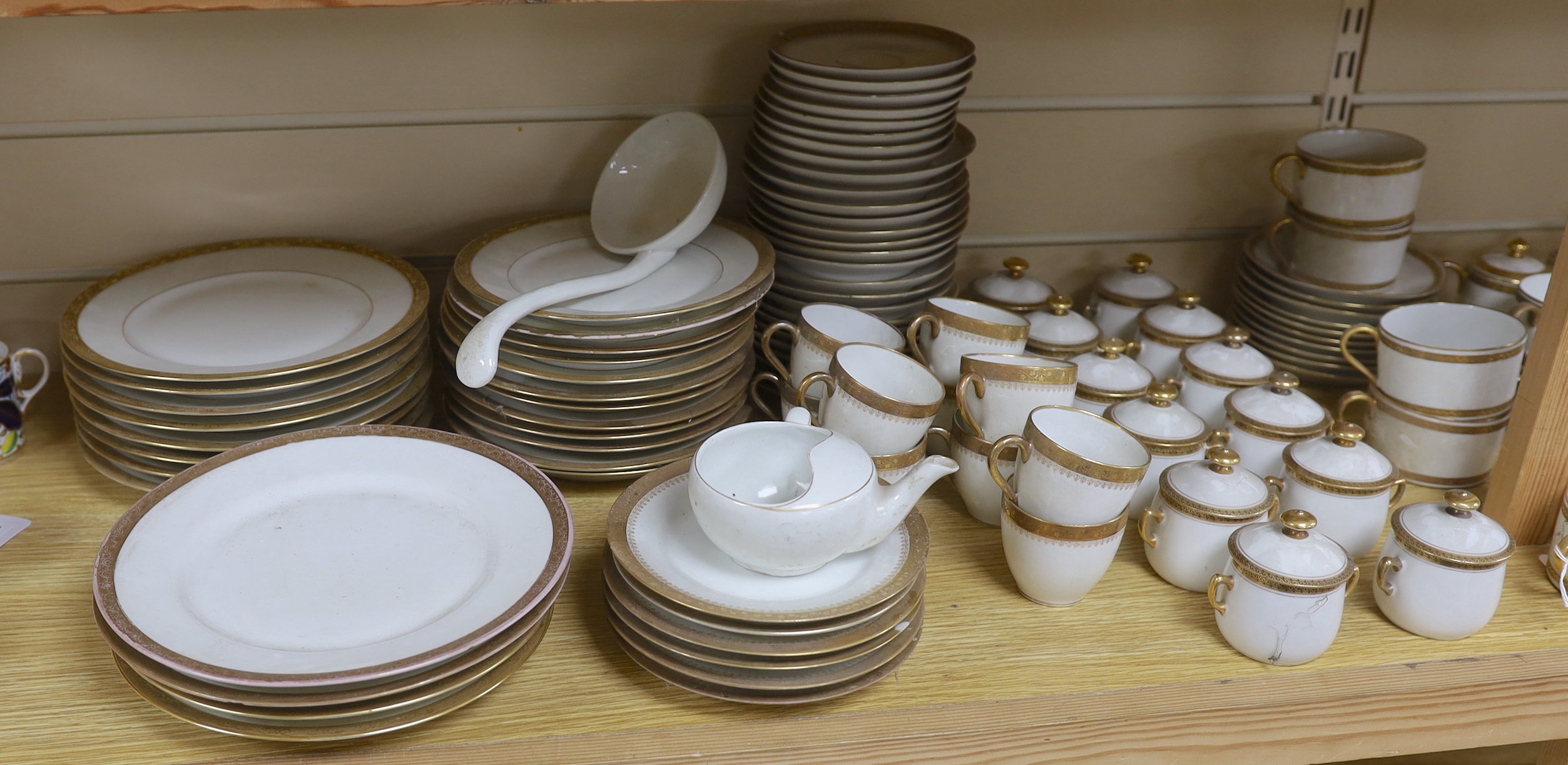 Three French Limoges gilt banded part dinner and tea services including cups, plates and jars & covers